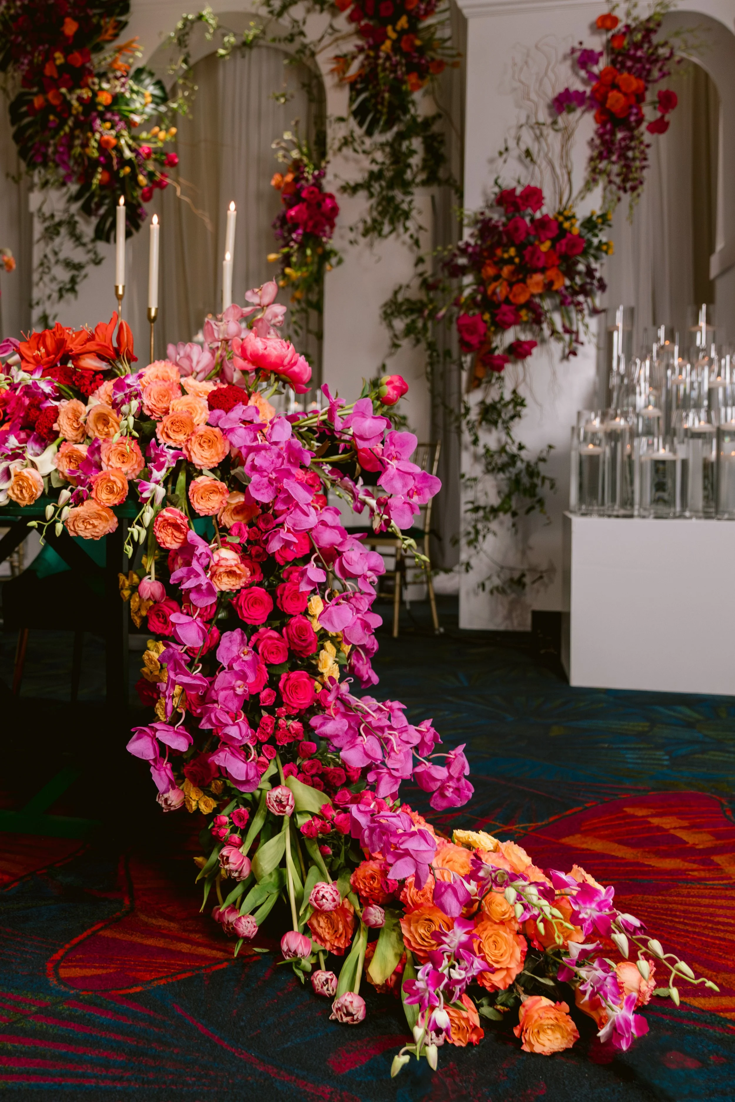 Cascading floral installation in a designed event environment